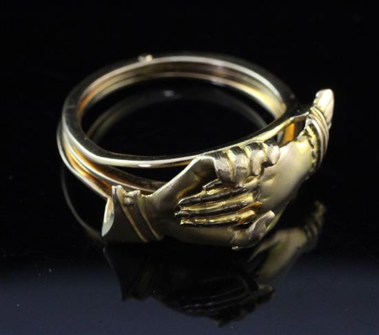 A continental gold articulated Friendship ring, size N.